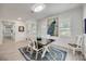Bright dining room with a modern table, stylish chairs, and eye-catching decor at 432 W Gate Dr, Venice, FL 34285