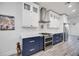 Well-equipped kitchen featuring custom cabinets, stainless steel appliances, and marble countertops at 432 W Gate Dr, Venice, FL 34285