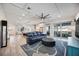 Spacious living room, featuring hardwood floors, an open layout, and sliding glass door at 432 W Gate Dr, Venice, FL 34285
