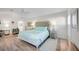 Large main bedroom with a comfortable bed, bright lighting, and relaxing decor at 432 W Gate Dr, Venice, FL 34285