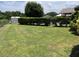 Spacious backyard featuring green lawn, mature trees, and a storage shed, offering ample outdoor space at 4509 30Th Street E Cir, Bradenton, FL 34203