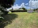 Expansive backyard with lush greenery, a storage shed, providing a private retreat for relaxation and outdoor activities at 4509 30Th Street E Cir, Bradenton, FL 34203