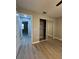 Bedroom featuring mirrored closet doors, laminate flooring, and neutral colored walls at 4509 30Th Street E Cir, Bradenton, FL 34203