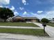 Lovely single-story home with an attached garage, lush landscaping, and a well-manicured lawn under a partly cloudy sky at 4509 30Th Street E Cir, Bradenton, FL 34203