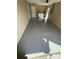 Epoxy-coated garage with laundry appliances and utility closet offers space for vehicles and storage at 4509 30Th Street E Cir, Bradenton, FL 34203
