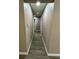 Hallway with laminate flooring and neutral-colored walls at 4509 30Th Street E Cir, Bradenton, FL 34203