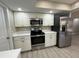 Well-lit kitchen featuring stainless steel appliances and ample counter space at 4509 30Th Street E Cir, Bradenton, FL 34203