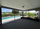 Enclosed lanai with views of the private pool and landscaped backyard, perfect for outdoor enjoyment at 4509 30Th Street E Cir, Bradenton, FL 34203