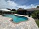 The kidney shaped pool is surrounded by a brick-paved deck and offers a private setting for relaxation and recreation at 4509 30Th Street E Cir, Bradenton, FL 34203