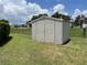 Outdoor shed in backyard offers additional storage space for tools and equipment at 4509 30Th Street E Cir, Bradenton, FL 34203