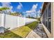 Private backyard with white fencing and healthy, green grass at 4608 Park Acres Dr, Bradenton, FL 34207