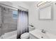 Bright bathroom with a tiled shower/tub combo, a modern sink, and a white vanity at 4608 Park Acres Dr, Bradenton, FL 34207