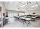 Spacious clubhouse room with tables, chairs, and plenty of natural light at 4608 Park Acres Dr, Bradenton, FL 34207