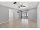 Open living room featuring a ceiling fan and sliding doors to the lanai at 4608 Park Acres Dr, Bradenton, FL 34207