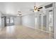 Empty living/dining room featuring tile flooring and mirrored accent wall at 4608 Park Acres Dr, Bradenton, FL 34207