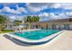 Beautiful community pool with clear blue water, seating, and a bath house at 4608 Park Acres Dr, Bradenton, FL 34207