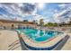 Resort-style community pool with a bathhouse, lounge chairs, and clear blue water at 4608 Park Acres Dr, Bradenton, FL 34207