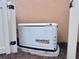 A Generac 16kW generator is installed on a concrete pad beside the home for reliable backup power at 5020 Savona Run, Bradenton, FL 34211