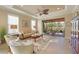Relax in the comfortable living room featuring tile floors, a ceiling fan, and an open floor plan at 5020 Savona Run, Bradenton, FL 34211