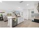 Kitchen with island seating open to the Gathering room, granite counter tops and stainless appliances at 5132 Rocky Coast Pl, Palmetto, FL 34221