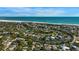 Aerial view of a coastal community with beach access and beautiful waterfront homes on the Intercoastal waterway at 5250 Calle De Rio, Sarasota, FL 34242