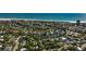 Aerial view of coastal community with ocean views, showcasing a vibrant neighborhood near the beach at 5250 Calle De Rio, Sarasota, FL 34242