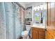 Cozy bathroom featuring nautical-themed decor, neutral color scheme, and vanity with storage at 5250 Calle De Rio, Sarasota, FL 34242