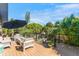 Relaxing outdoor deck with comfortable seating and a gas fire pit, perfect for enjoying the view at 5250 Calle De Rio, Sarasota, FL 34242