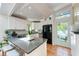 Modern kitchen with gray countertops, white cabinets, and stainless steel appliances at 5250 Calle De Rio, Sarasota, FL 34242
