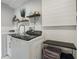 Contemporary laundry room featuring modern appliances and functional design for added convenience at 5250 Calle De Rio, Sarasota, FL 34242