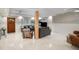 Living room with cozy seating, stylish decor, a wooden beam and great natural light, ideal for relaxation at 5250 Calle De Rio, Sarasota, FL 34242