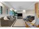 Inviting living room with two plush sofas, stylish decor, and natural light filling the space at 5250 Calle De Rio, Sarasota, FL 34242