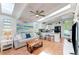 Bright living room with skylights, open to the kitchen, and stylish decor at 5250 Calle De Rio, Sarasota, FL 34242