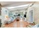 Bright living room with tile flooring, skylights, and open concept kitchen view at 5250 Calle De Rio, Sarasota, FL 34242