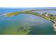Breathtaking aerial view of the coastline featuring stunning turquoise waters at 625 Duchess Blvd, Dunedin, FL 34698