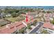 Community aerial view with mature trees, pool, and tennis courts at 625 Duchess Blvd, Dunedin, FL 34698