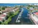 Aerial view of waterfront homes with boat docks on a beautiful canal at 625 Duchess Blvd, Dunedin, FL 34698