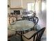 Inviting amenity room with tables, chairs, and a cozy fireplace at 625 Duchess Blvd, Dunedin, FL 34698