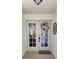 Welcoming entryway featuring double doors and decorative accents at 625 Duchess Blvd, Dunedin, FL 34698