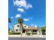 Charming two-story home with lush landscaping and a welcoming entrance at 625 Duchess Blvd, Dunedin, FL 34698