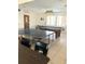 Bright game room features a pool table and ping pong table for hours of fun and recreation at 625 Duchess Blvd, Dunedin, FL 34698