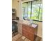 Detailed view of a home office space showcasing natural light and functional desk area at 625 Duchess Blvd, Dunedin, FL 34698