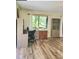 Well-organized home office space with natural light and wood-look flooring throughout at 625 Duchess Blvd, Dunedin, FL 34698