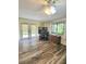 Functional home office with desk, storage, and ample natural light from surrounding windows at 625 Duchess Blvd, Dunedin, FL 34698