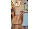Updated kitchen boasts stainless appliances, granite countertops, and wood-look floors at 625 Duchess Blvd, Dunedin, FL 34698