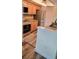 Kitchen with stainless steel appliances, granite counters, and wood-look flooring at 625 Duchess Blvd, Dunedin, FL 34698