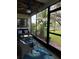 Relaxing screened lanai with comfortable seating and view of the outdoors at 625 Duchess Blvd, Dunedin, FL 34698