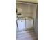 Laundry room featuring a washer and dryer with shelving for storage at 625 Duchess Blvd, Dunedin, FL 34698