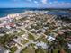 Wide-angle aerial view of neighborhood, beach and intercoastal waterway at 721 Cadiz Rd, Venice, FL 34285