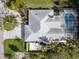 Aerial view of home showcasing roof, yard and screened-in pool at 721 Cadiz Rd, Venice, FL 34285
